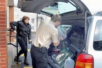 Travis Keller puts groceries in customer Debbie Bozek's car after her shopping visit to the Youngwood Corner Market. The market is close to her Hunker home.