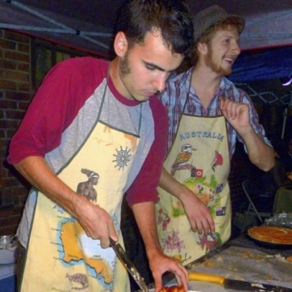 Louis Butler, left, and Wren McGalliard of The Pittsburgh Pie Guy serve slices  of their pies at the last Night Market in September.