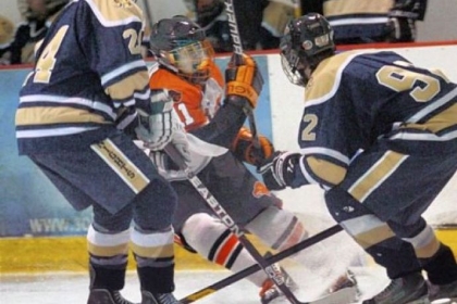 Bethel Park's Derek Lesnak battles in front of the net with Norwin's Dan Merz, left, and Christian Slafka during a game earlier this season. Lesnak, a junior captain, leads a Black Hawks team that is the least-penalized unit in PIHL Class AAA at 64 penalty minutes.