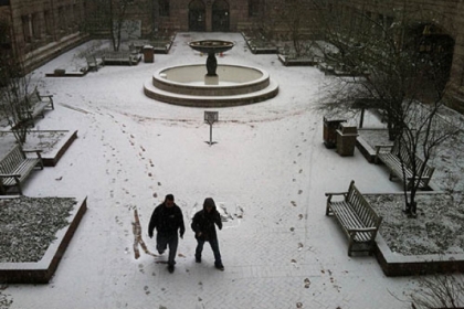 Snow starts to stick Friday morning in the courtyard of the Allegheny County Courthouse in Downtown Pittsburgh.