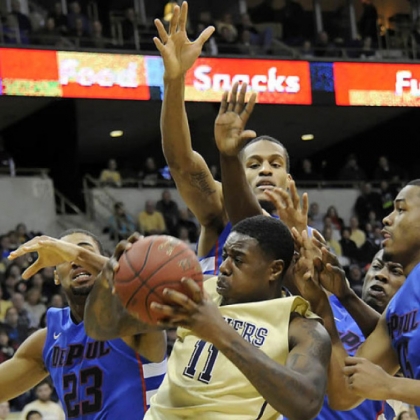 Pitt's Dante Taylor pulls down a rebound against DePaul in the first half at the Petersen Events Center.