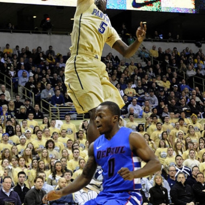 Pitt's Durand Johnson dunks in front of DePaul's Worrel Clahar in the first half.