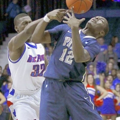 DePaul guard Charles McKinney battles Pitt guard Ashton Gibbs for a loose ball in January 2012 in Rosemont, Ill. DePaul upset the Panthers, 84-81, after Pitt blew a 10-point second-half lead.