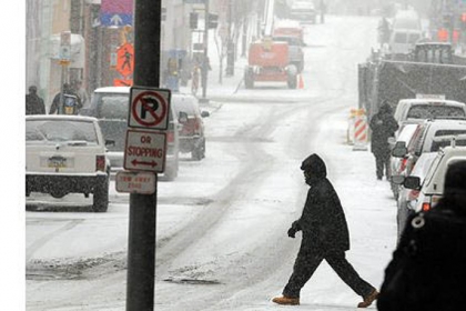 The region is digging out from under yesterday's winter storm, seen here in this Friday view of snowbound Forbes Avenue from Smithfield Street.