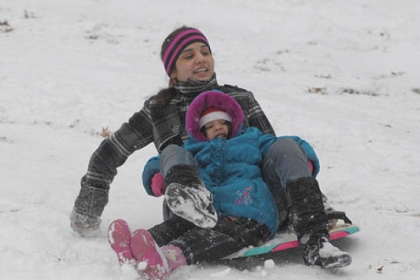 Sana Samson of Mt. Lebanon sleds in Mt. Lebanon Park with her daughter Shiloh, 4.