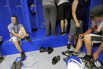 Eric Dompierre, 19, who has Down syndrome and is the kicker for the Ishpeming High School varsity football team, prepares for the first day of practice Aug. 6 at the Ishpeming Playgrounds in Ishpeming, Mich.
