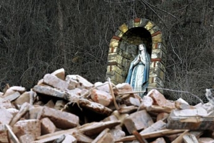The Virgin Mary overlooks the rubble of what used to be St. Nicholas Church on Route 28.
