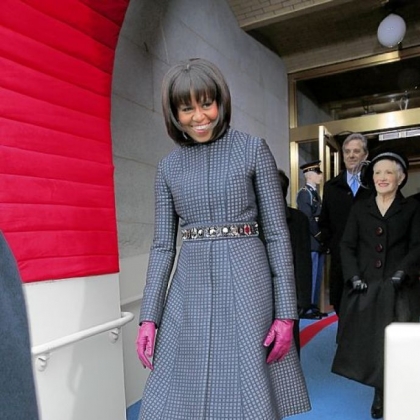 First lady Michelle Obama wears a Thom Browne navy coat and dress ensemble to the president's inauguration Monday.