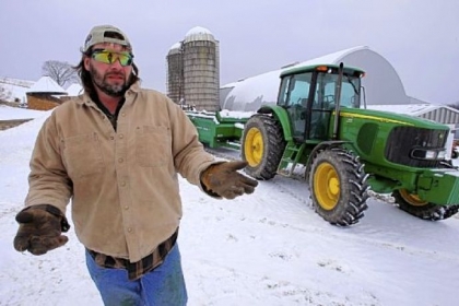 Shawn Georgetti pauses on his 167-acre family dairy farm Saturday in Avella. With royalties from a Range Resources gas well on his property, Mr. Georgetti has been able to buy newer farm equipment that's bigger, faster and more fuel-efficient.