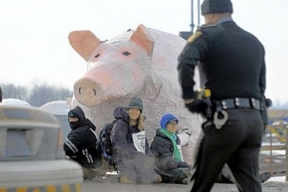 Fracking protesters gather Sunday before a giant papier-mache pig along Mount Jackson Road in South Beaver, Lawrence County. The protesters chose the pig because of a drilling site019s proximity to a nearby organic farm, where pigs are raised, and what they termed a 01Cpiggish gas industry.01D