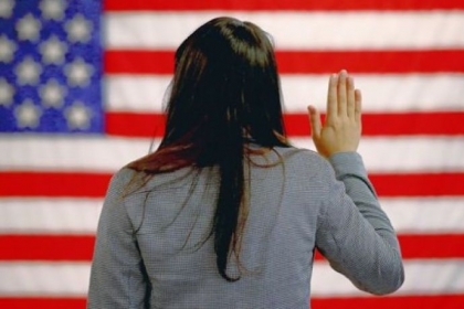 A woman takes the oath of allegiance Monday during a naturalization ceremony in Newark, N.J.
