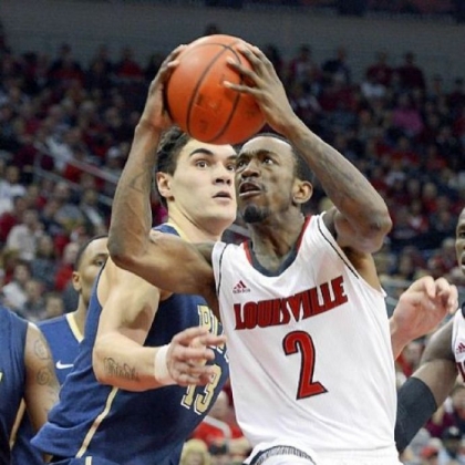 Louisville's Russ Smith drives around the defense of Pitt's Steven Adams during the second half in Louisville, Ky.