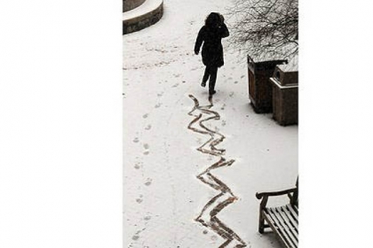 A woman left a "skating" pattern in the  fresh snow in the Allegheny County Courthouse Friday morning.