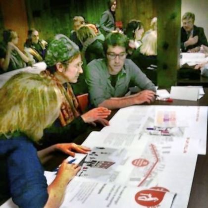 Participants at a recent Upper Lawrenceville meeting confer on neighborhood improvement strategy.