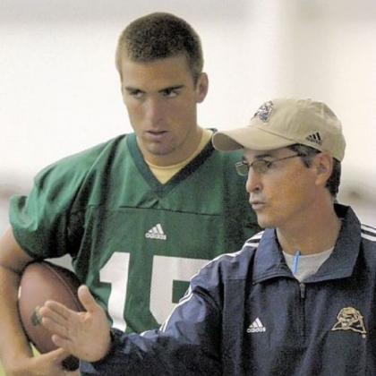 Pitt head coach Walt Harris talks with quarterback Joe Flacco during practice.