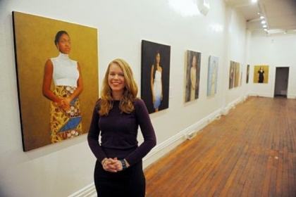 Artist Sonja Sweterlitsch with her portrait of singer-songwriter Joy Ike and the exhibit "Beautiful Dreamers" at Fe Gallery, Lawrenceville.
