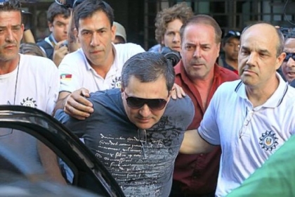 Mauro Hoffman, co-owner of the Kiss nightclub, is taken into custody Tuesday by police in Santa Maria.