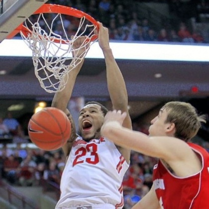 Ohio State's Amir Williams, left, dunks over Wisconsin's Sam Dekker in the second half of the Buckeyes' 58-49 Big Ten victory Tuesday night in Columbus, Ohio.