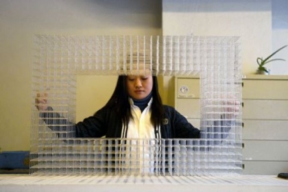 Eunsuh Choi works on creating a piece for her exhibition at the Pittsburgh Glass Center.