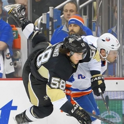 Kris Letang appears to be catching a ride on the back of New York's Mark Streit Tuesday night at Consol Energy Center in the Penguins' disappointing 4-1 loss.