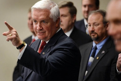 Governor Tom Corbett answers questions at a press conference in Pittsburgh, where he announced his plans to privatize the sale of alcohol in Pennsylvania.