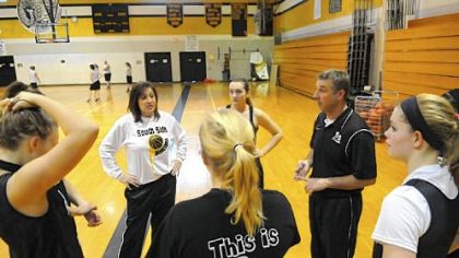 Husband-and-wife basketball coaches Debby and Dave Wilson run the South Side Beaver girls practice Dec. 31. The Wilsons are believed to be the first husband and wife coaching duo in WPIAL history.