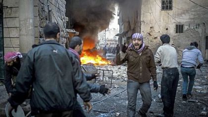 A man shouts after a missile hits a house in Aleppo, Syria, on Thursday.