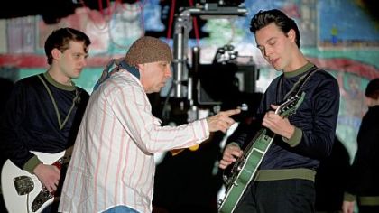 Executive producer/music supervisor Steven Van Zandt, center, works with Will Brill, left, and Jack Huston on the set of "Not Fade Away."