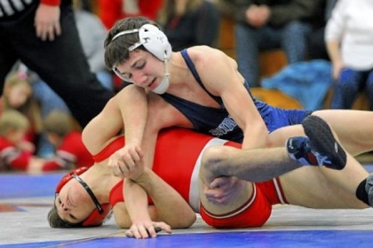 Burrell's Damon Greenwald, top, subdues Kittanning's Evan Bowser.