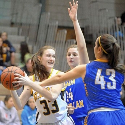 Mt. Lebanon's Christine Ehland tries to pass around Canon-McMillan's Danielle Parker and Olivia Lorusso.