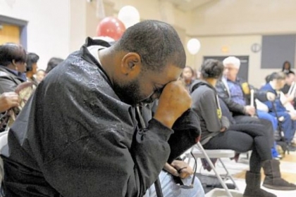 Daniel Cutrary of Sheraden mourns his uncle, Isaiah Dent, along with 200 people at the Hays Manor housing development community center in McKees Rocks. Mr. Dent, 61, a community activist and clothing designer, was found beaten to death in his apartment.