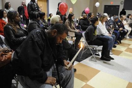 Daniel Cutrary, left, of Sheriden, mourns his uncle,  Isaiah Dent, 61.