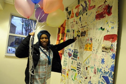 Kelsey Brown, 15, of Crafton, shows off a quilt she helped make with Isaiah Dent, 61.