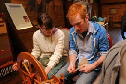 Natalie Woodruft, a junior at Saint Vincent College, and Zach Noble, a senior, split the spinning duties while learning to spin.