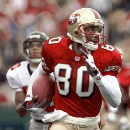 Jerry Rice runs for a touchdown in 1998.