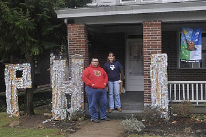 Anthony Skariot and his wife Deana Carpenter, founders of the Outer Circle, a club that celebrates Groundhog Day all year round, in front of their Castle Shannon home.