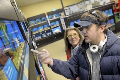 Jonah Fite, who has an aquarium at his South Side house, shops at the Waterfront for new fish. His mother, Cindy McHolme, accompanies him, as she sometimes does on trips to stores, doctors' offices and supermarkets.