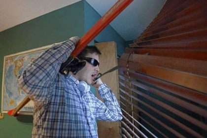 Jonah wrestles with skis in his house, on a day when he was convinced he would be going on a ski trip with a Post-Gazette photographer, even though there were no such plans. The skis got stuck in his window blinds, and he pried them out with the help of a sword he keeps at his home. He is taking a new antipsychotic medication, Latuda, to combat those kinds of delusions.