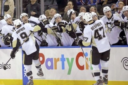 Teammates congratulate right wing Pascal Dupuis and defenseman Simon Despres after Despres scored a goal and Dupuis assisted in the third period of the Penguins' 3-0 win against the Rangers Thursday night. It was the first goal of the season for Despres.