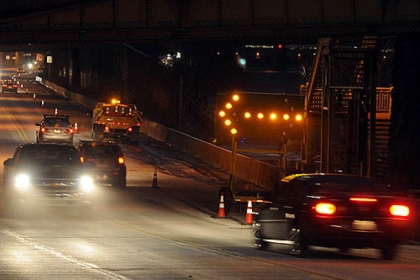 Westbound traffic along the Tenth Street Bypass was restricted before dawn by rising river water and the ice it created.