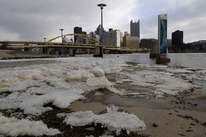 Chunks of ice lay along the North Shore as the waters of the Allegheny River receded today.