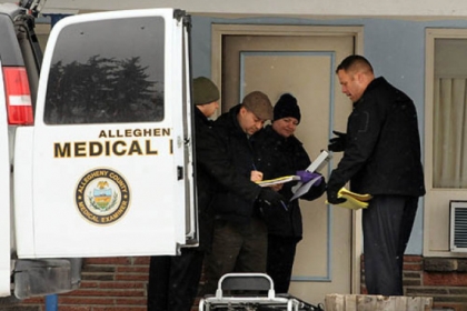 Officals investigate the discovery of a body at the East Exit Motel, on William Penn Highway in Monroeville.