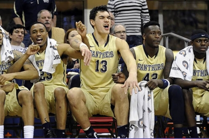 Pitt's Steven Adams celebrates with teammates as Tray Woodall makes a late-game free throw against Syracuse late in the second half at the Petersen Events Center this afternoon.
