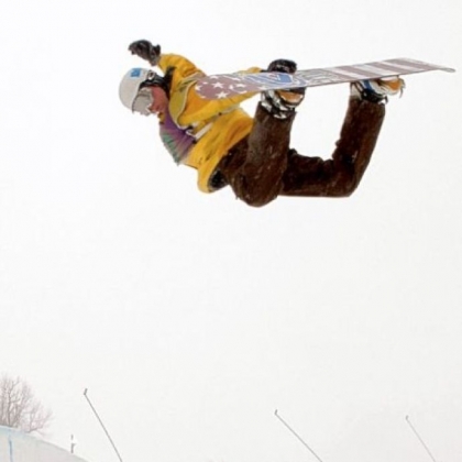 Snowboarder Dan Genditzki of Bedford, Pa., practices in the halfpipe at Seven Springs Mountain Resort Friday in preparation for the U.S. Open Snowboarding Championships qualifiers this weekend. Genditzki is doing a method grab, a fundamental snowboarding trick where the rider grabs the board behind his back with his lead hand.