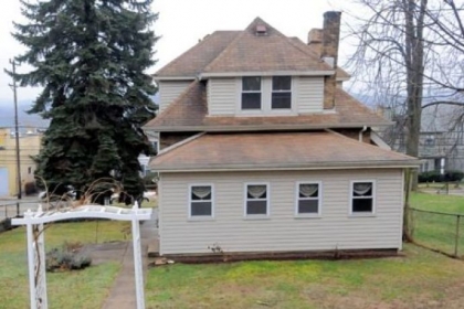 The fenced-in backyard of 455 Freeport Road.