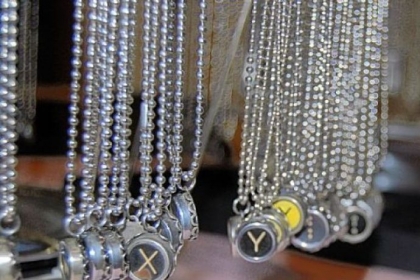 The typewriter necklaces made by Jeanne Cherry, 56, of Plum will be among items for sale at the I Made It! market from noon to 5 p.m. today at the former Joseph-Beth Booksellers store in the SouthSide Works.