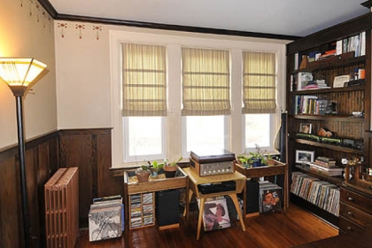 On the second floor, Chris Clarke built bookcases and installed dark wainscoting to create an office.