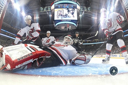 The Penguins' Evgeni Malkin watches as his assist to Sidney Crosby trickles past Devils' goalie Martin Brodeur in the second period this afternoon at Consol Energy Center.