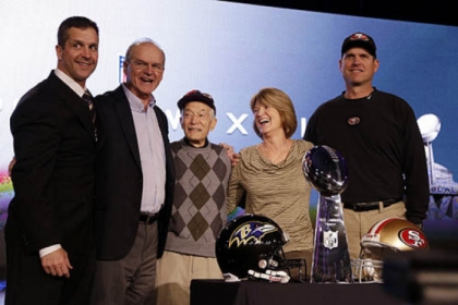 San Francisco 49ers head coach Jim Harbaugh, right, and Baltimore Ravens head coach John Harbaugh, left, pose with their parents, Jack and Jackie, and grandfather Joe Cipiti during a news conference.