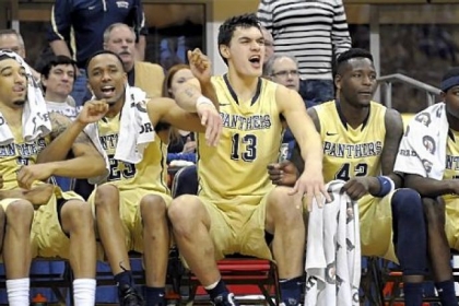 Steven Adams celebrates with teammates as Tray Woodall makes a late free throw to help seal the Panthers' upset of No. 6 Syracuse.